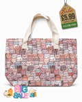 Beach tote bag with soft pastel cat print and cream canvas carry handles