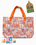 Beach tote bag with warm peach and terracotta cat print and tangerine orange carry handles