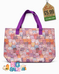 Beach tote bag with purple and pink cat print and rich grape purple carry handles