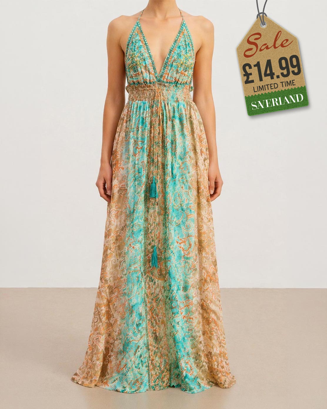 Turquoise and gold paisley halter maxi dress on studio background