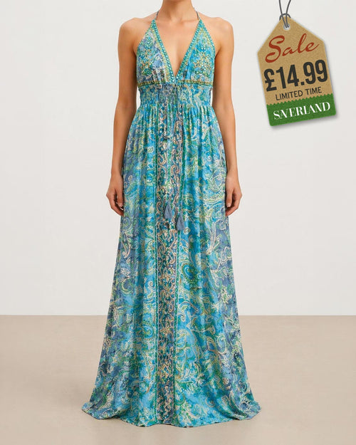 Aqua and gold paisley halter maxi dress on studio background