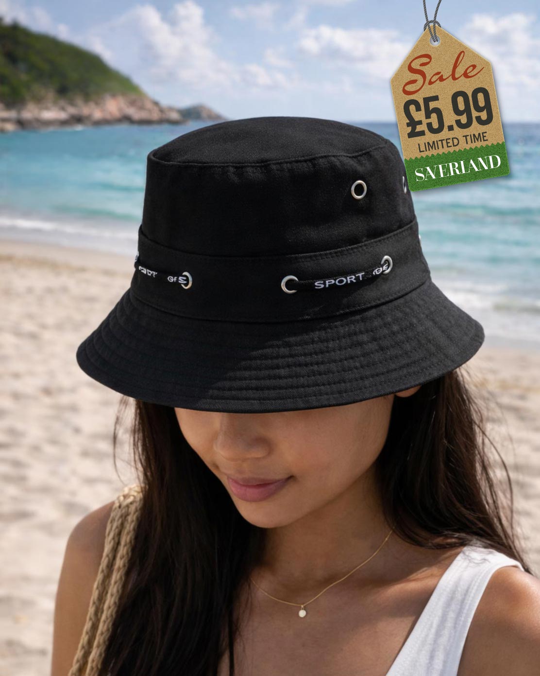 Black cotton sport bucket hat shown upright and interior view on sand at beach