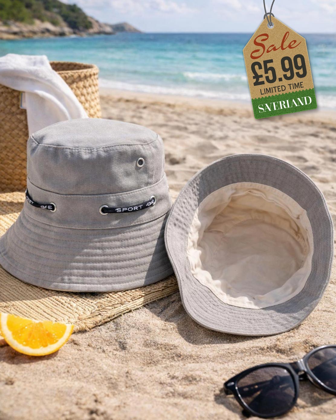 Grey cotton sport bucket hat with cord hatband shown upright and interior view on sand at beach