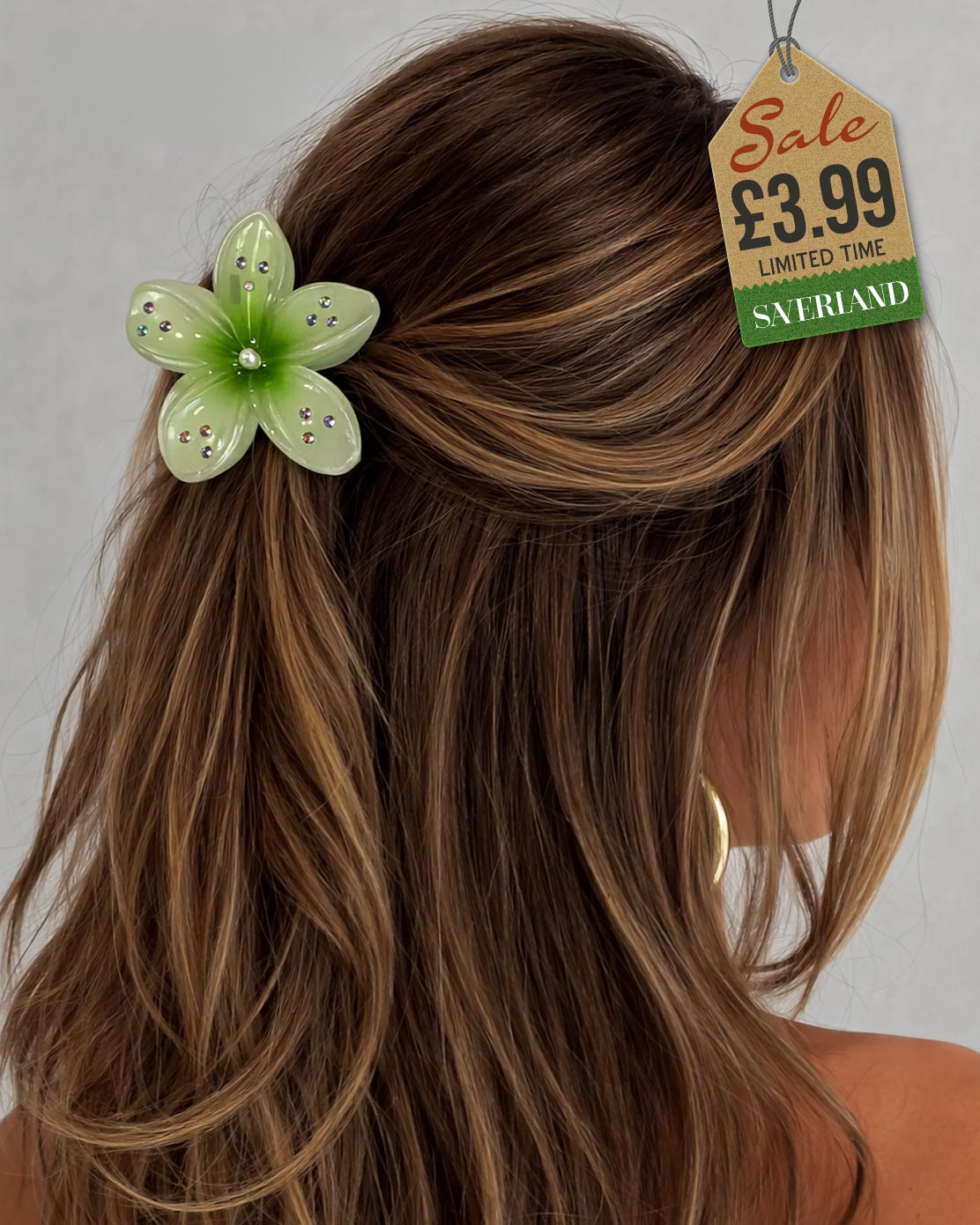 Green sparkle flower hair clip with rhinestones in long hair
