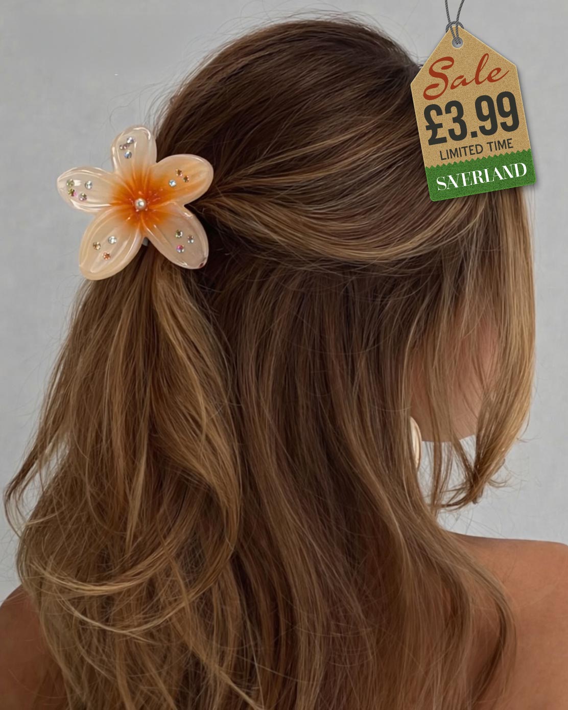 Peach sparkle flower hair clip with rhinestones in wavy hair