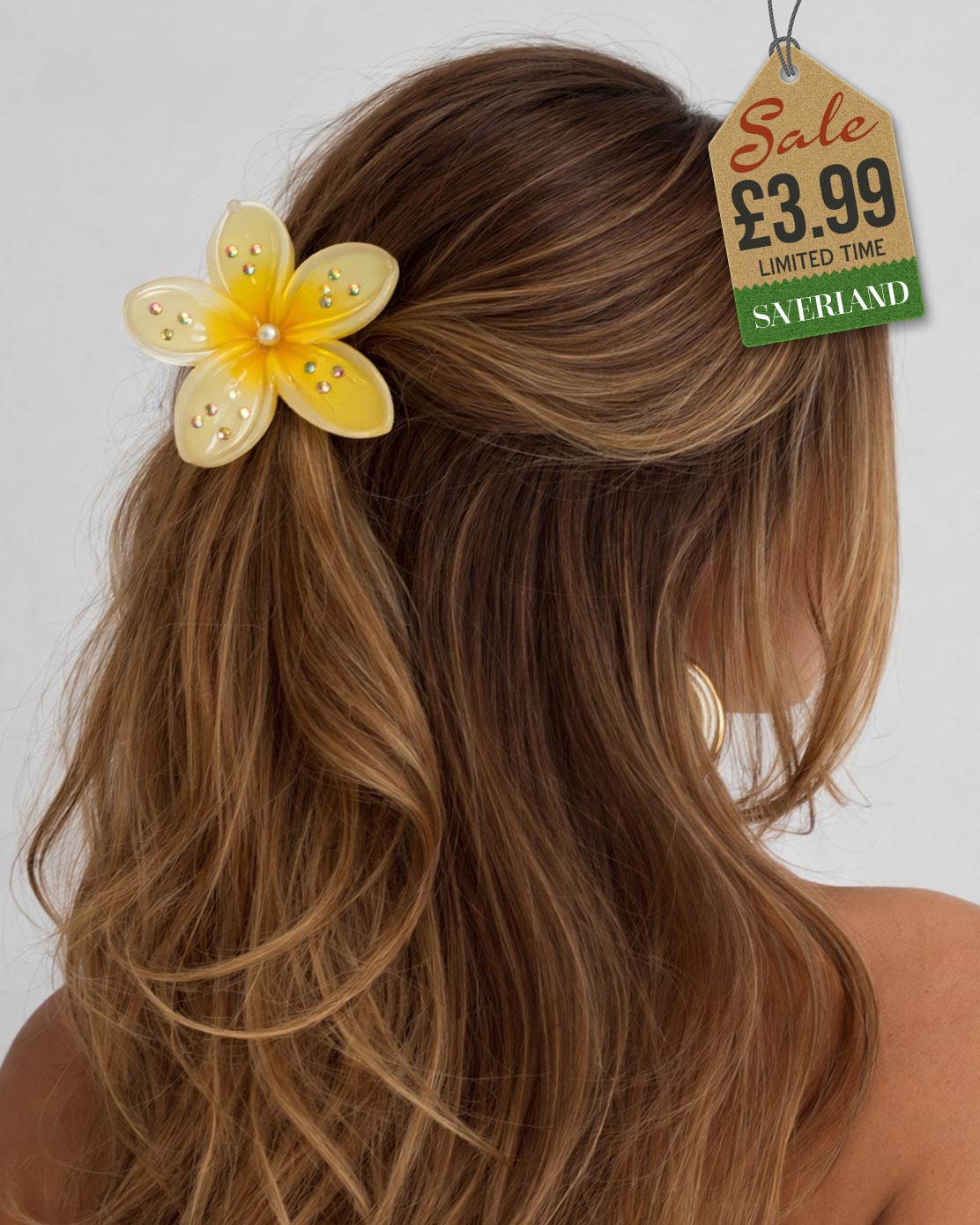 Yellow sparkle flower hair clip with rhinestones in wavy hair