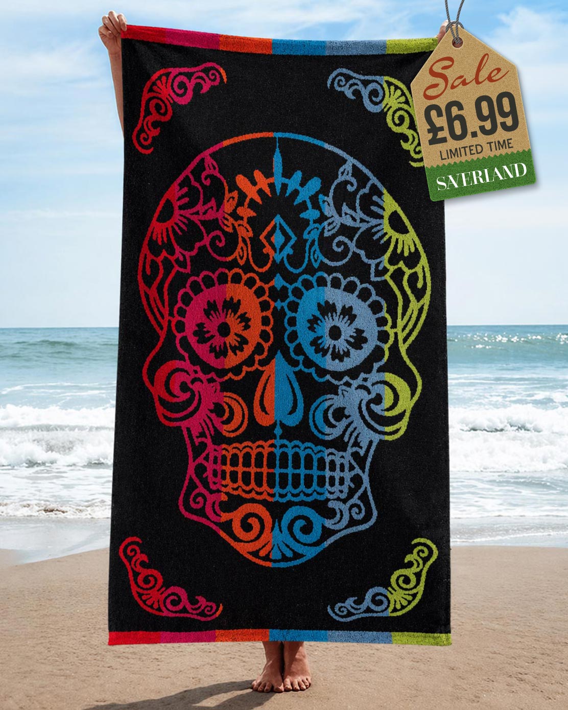 Black sugar skull Day of the Dead beach towel with multicolour skull design held up at the beach