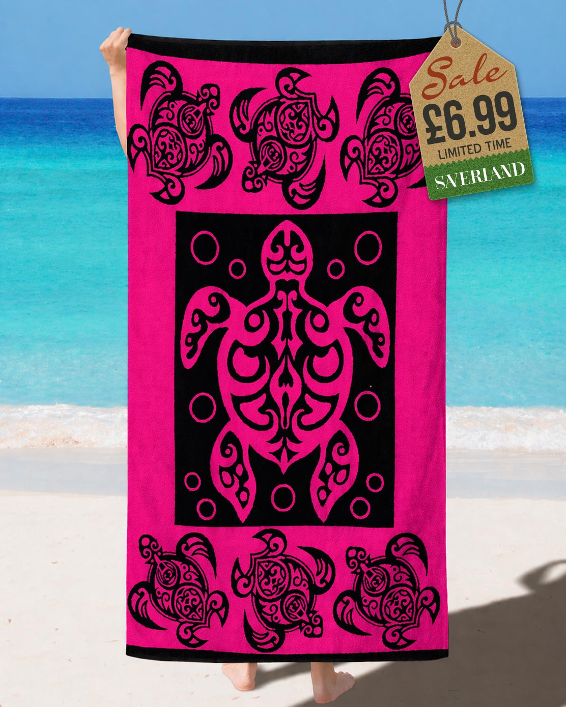 Hot Pink and black tribal Polynesian sea turtle beach towel held up at the beach