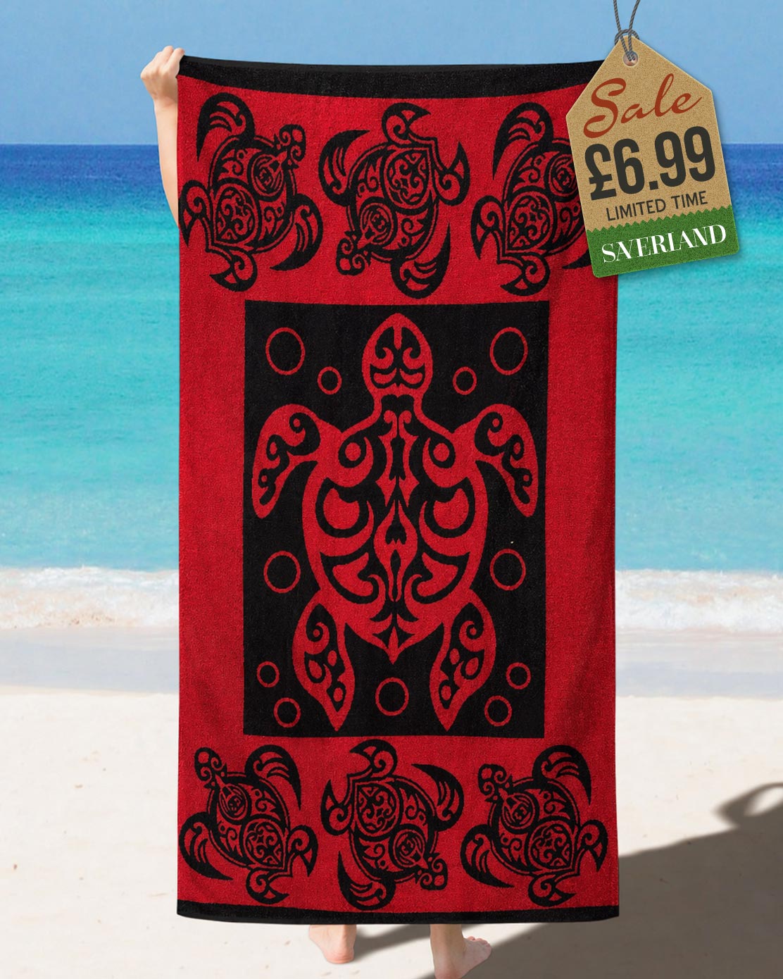 Red and black tribal Polynesian sea turtle beach towel held up at the beach