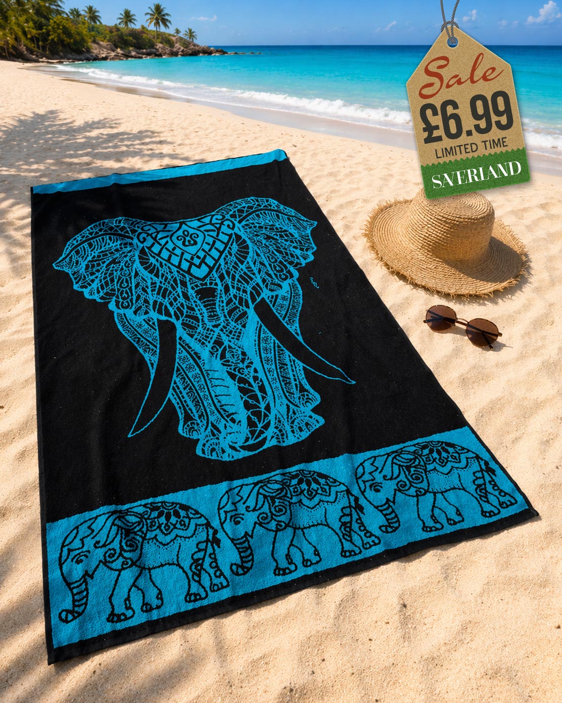 Turquoise tribal elephant head beach towel laid on sand at tropical beach