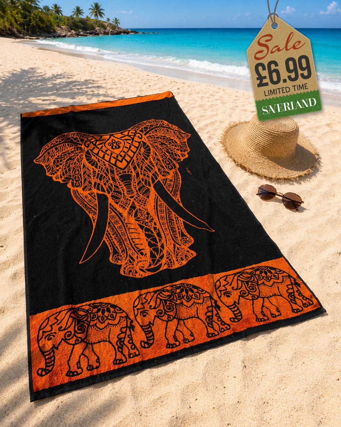 Burnt Orange tribal elephant head beach towel laid on sand at tropical beach