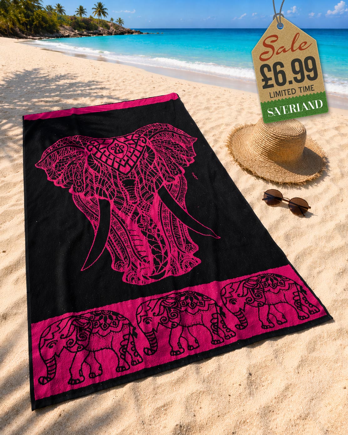 Hot Pink tribal elephant head beach towel laid on sand at tropical beach