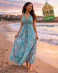 Turquoise paisley halter maxi dress showing deep V-neck and tassel waist detail