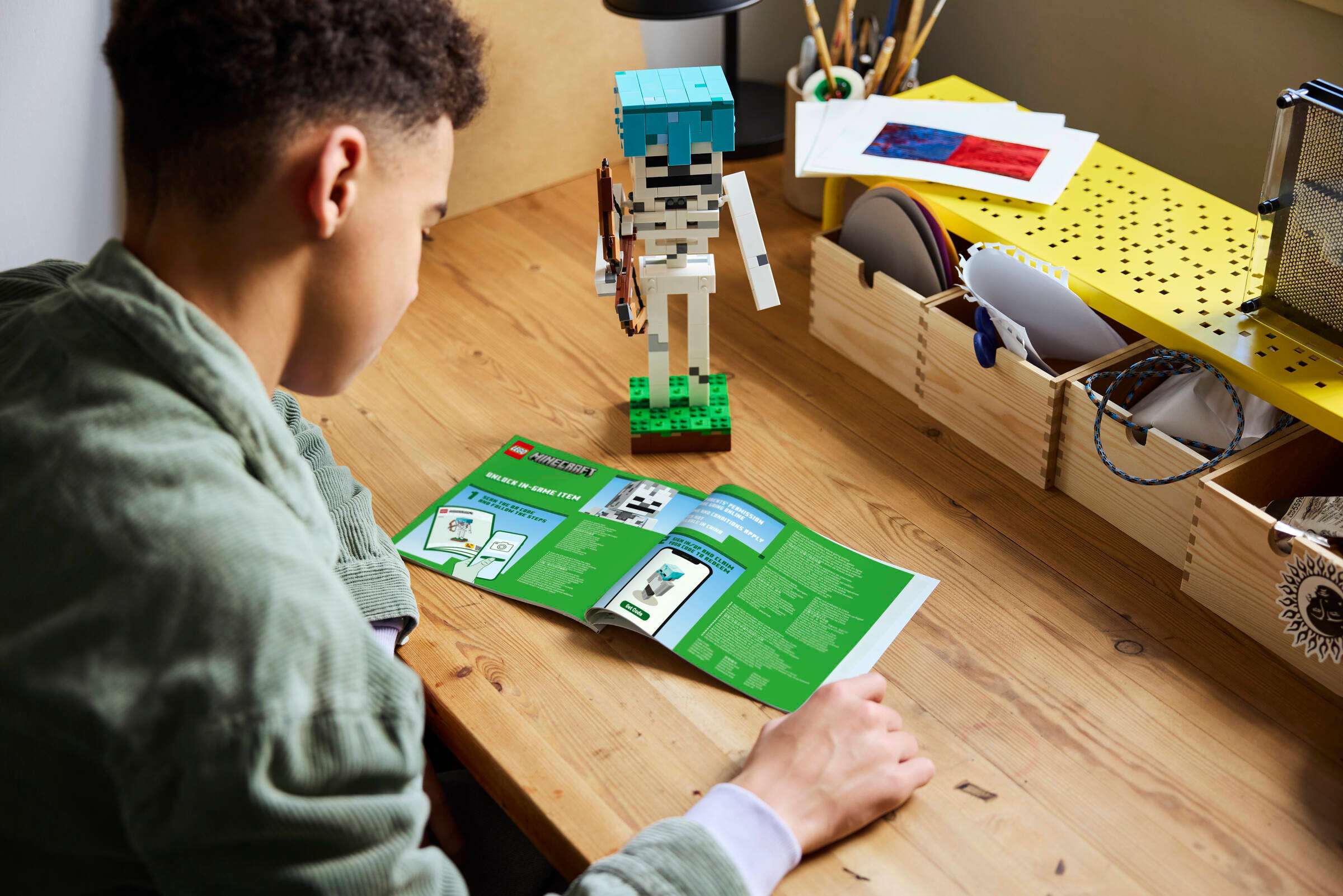 Child reading the LEGO Minecraft Skeleton instructions