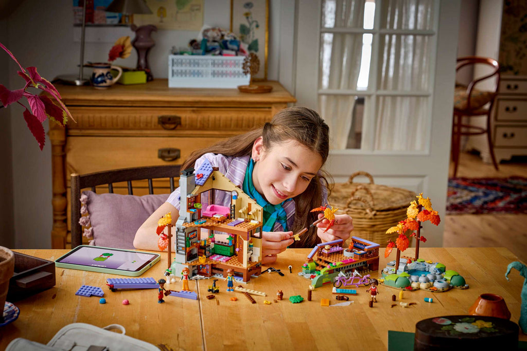 LEGO Friends Cozy Fall Forest Cabin 42705 being built