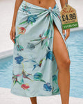 Mint aqua background beach sarong with scattered multicolour tulip floral print tied at the hip