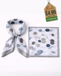 Muted tones cherry print satin scarf shown tied in neck scarf knot and flat square product view