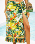 Green and orange tropical lemon and floral beach sarong wrap with tassel fringe tied at the hip