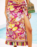Magenta and yellow tropical lemon and floral beach sarong wrap with tassel fringe tied at the hip