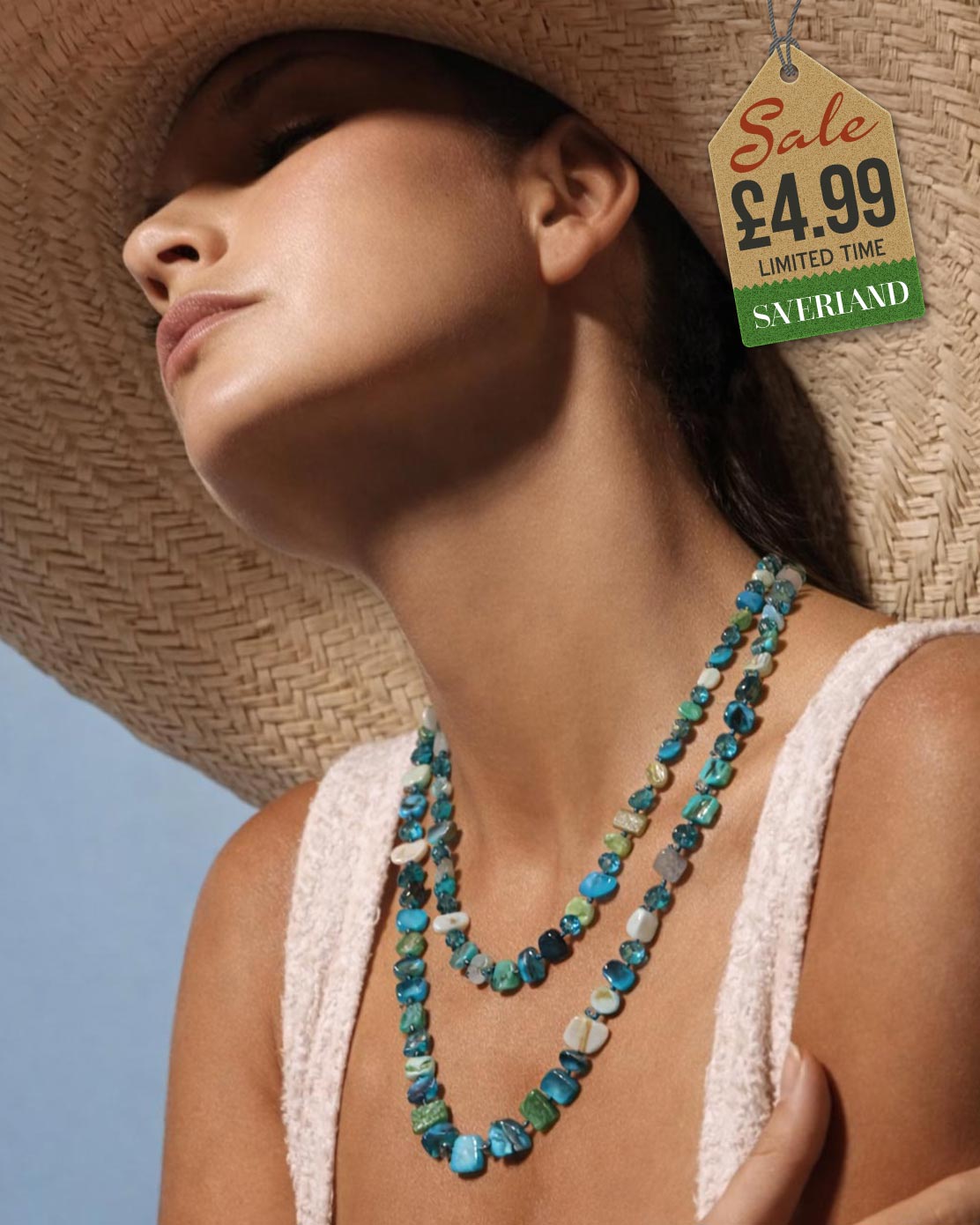 Mixed ocean tone shell chip and teal crystal bead necklace worn as a double-strand at the beach