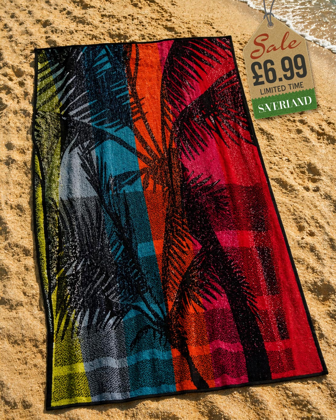 Tropical palm leaf print beach towel with colour-blocked teal, orange, red and lime green design laid on sand