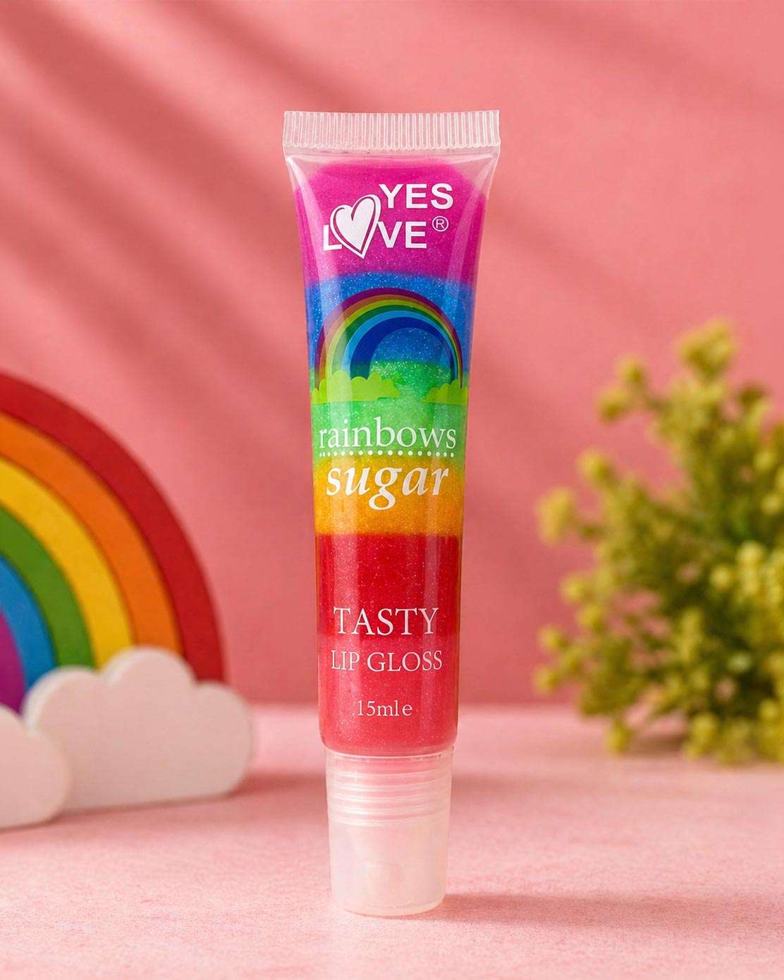 Yes Love Rainbows Sugar Tasty Lip Gloss 15ml tube with rainbow design on pink background