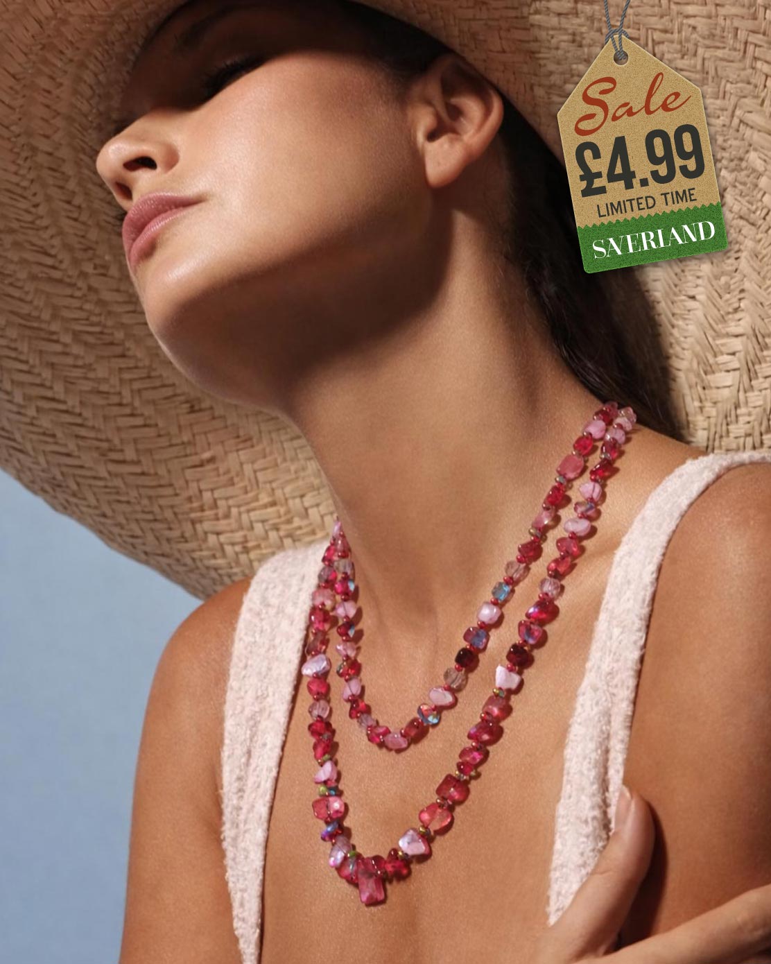Rose pink shell chip and crystal bead necklace worn as a double-strand at the beach
