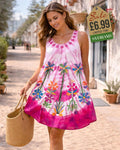 Pink tie-dye short dress with vibrant hand-painted tropical flower and palm motif