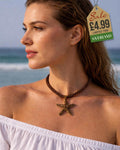 Bronze brown textured starfish pendant choker necklace on twisted brown rope cord worn at beach
