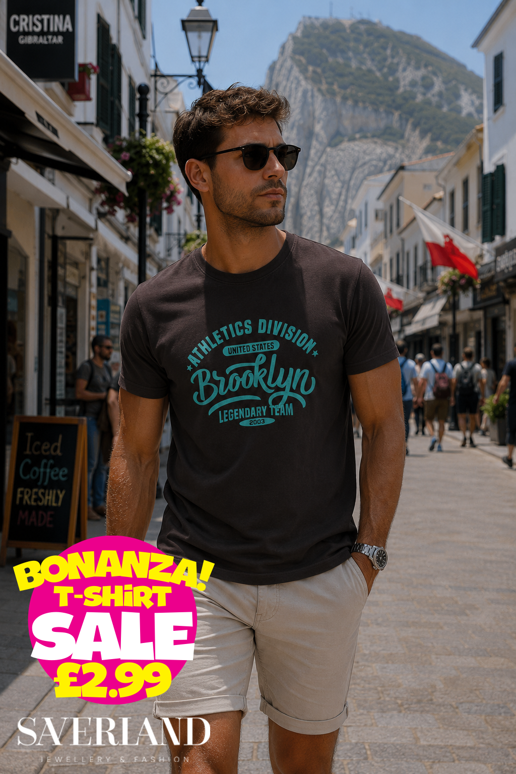 Dark charcoal men's t-shirt with teal Brooklyn Athletics Division Legendary Team 2003 graphic print, worn outdoors in Gibraltar
