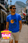 Royal blue San Diego California sunset palm tree graphic t-shirt worn by a man in Gibraltar