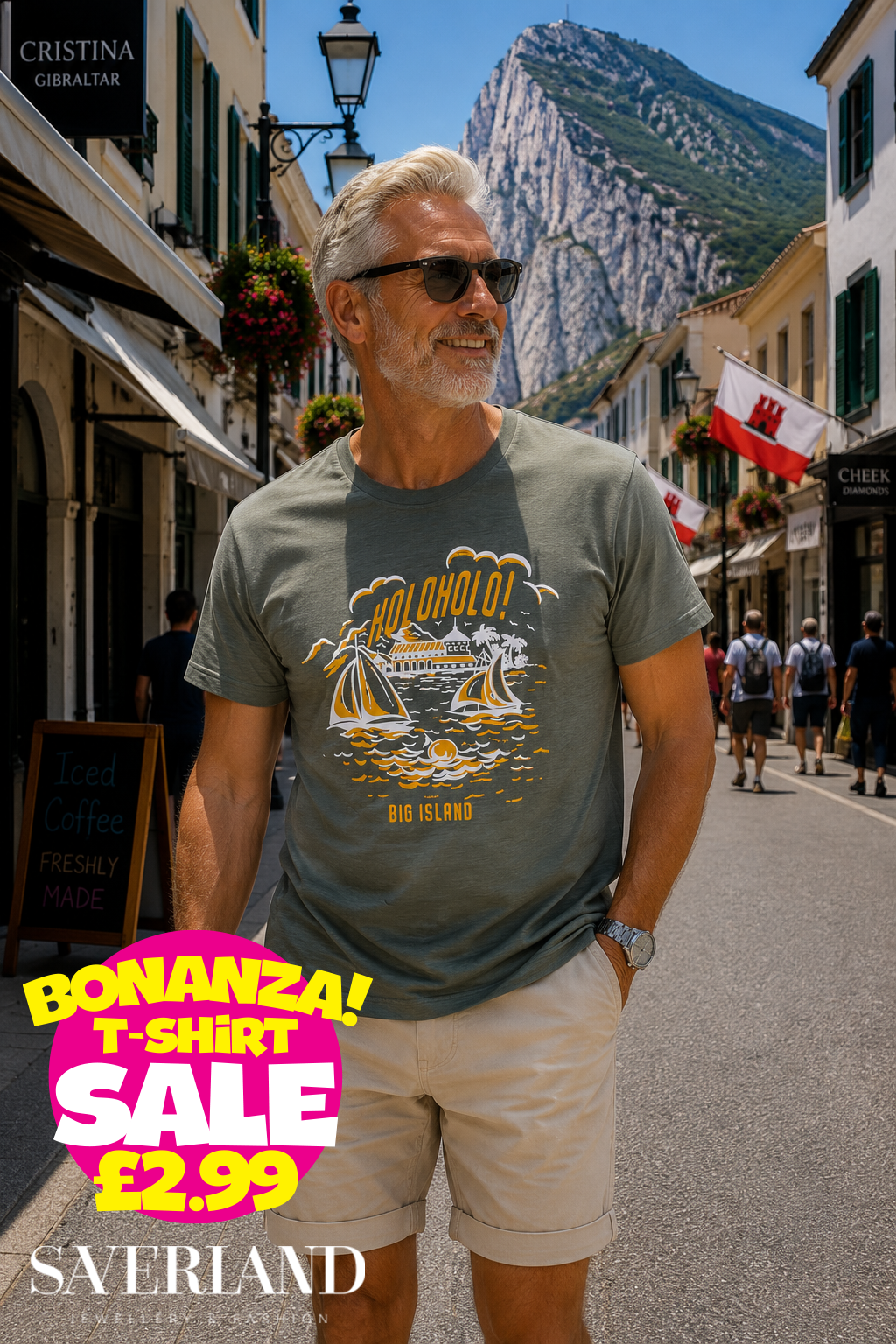 Man wearing an olive green t-shirt with a Holoholo Big Island sailboat graphic print, photographed on a Gibraltar street