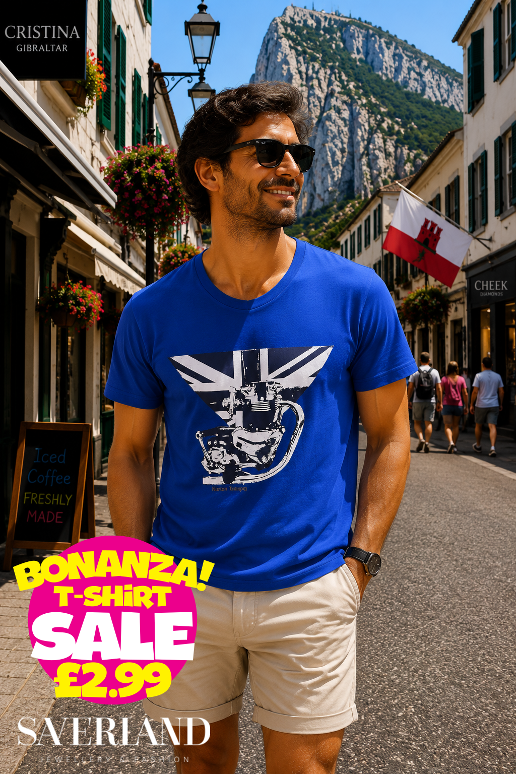 Man wearing a royal blue t-shirt with a Norton Triumph motorcycle and Union Jack graphic, photographed on a sunny Gibraltar street