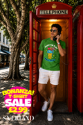Green graphic t-shirt with ice cream cone design and Enjoy The Play Bright Future slogan worn by a man in a red telephone box