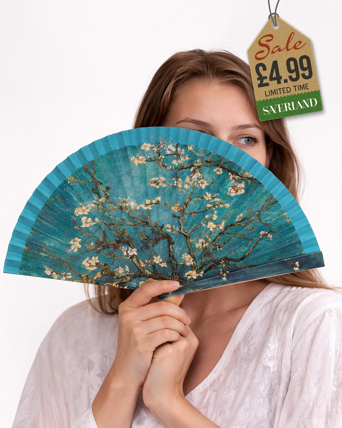 Folding hand fan with a print inspired by Almond Blossoms by Vincent van Gogh with teal blue frame held by woman