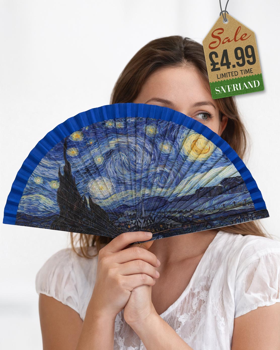 Folding hand fan with a print inspired by The Starry Night by Vincent van Gogh with deep blue frame held by woman