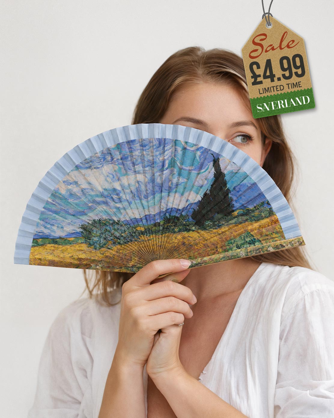 Folding hand fan with a print inspired by Wheat Field with Cypresses by Vincent van Gogh with sky blue and white frame held by woman